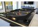 Close up of the game room's pool table featuring colorful pool balls ready for play at 22339 N 77Th Way, Scottsdale, AZ 85255