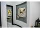 Inviting hallway with modern art, sleek design, and a view to an outdoor scenery at 22339 N 77Th Way, Scottsdale, AZ 85255