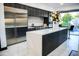 Modern kitchen featuring an island with marble countertops and stainless steel appliances at 22339 N 77Th Way, Scottsdale, AZ 85255