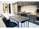 Open kitchen design with island and stainless steel appliances, with dining table and chairs at 22339 N 77Th Way, Scottsdale, AZ 85255