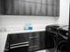Modern laundry room featuring sleek cabinetry, countertops, and high-end washer and dryer appliances at 22339 N 77Th Way, Scottsdale, AZ 85255