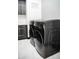 Close-up view of modern black washer and dryer units in a bright laundry room at 22339 N 77Th Way, Scottsdale, AZ 85255