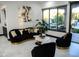 Stunning living room featuring modern decor, bright lighting, and a beautiful view of the outdoors at 22339 N 77Th Way, Scottsdale, AZ 85255