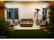 Inviting outdoor patio features a cozy seating area with a fire pit and stylish furnishings for relaxation and entertaining at 22339 N 77Th Way, Scottsdale, AZ 85255