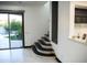 The staircase leads to the second floor, and is located adjacent to the bar and pool access at 22339 N 77Th Way, Scottsdale, AZ 85255