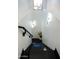 The staircase features dark steps, white walls, and modern lighting fixtures at 22339 N 77Th Way, Scottsdale, AZ 85255