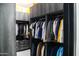 Spacious walk-in closet with hanging rods, shelving, drawers, and overhead storage at 22339 N 77Th Way, Scottsdale, AZ 85255