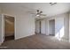 Spacious bedroom featuring a ceiling fan, neutral walls, carpet flooring and sizable closet at 22583 W Lasso Ln, Buckeye, AZ 85326