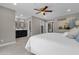 This main bedroom features a ceiling fan, neutral colors, and adjoins a gorgeous bathroom at 2276 E Mercer Ln, Phoenix, AZ 85028