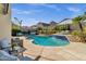 Resort style pool with desert landscaping, steps, and ample seating at 2276 E Mercer Ln, Phoenix, AZ 85028