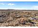 Aerial view of the desert community with houses and neighborhood streets in the distance at 2855 N Silver Spur Dr, Wickenburg, AZ 85390
