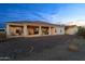 Expansive backyard featuring a covered patio, desert landscaping, and an expansive gravel area at 2855 N Silver Spur Dr, Wickenburg, AZ 85390