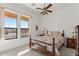 Bright bedroom with floral bedding, wood furniture, and a desert view at 2855 N Silver Spur Dr, Wickenburg, AZ 85390