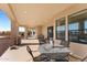 Inviting covered patio features a dining table and view to another covered patio area at 2855 N Silver Spur Dr, Wickenburg, AZ 85390