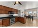 Modern kitchen with stainless steel oven and an adjacent dining area at 2855 N Silver Spur Dr, Wickenburg, AZ 85390