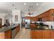 Well-equipped kitchen with wooden cabinets and stainless steel appliances at 2855 N Silver Spur Dr, Wickenburg, AZ 85390