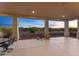 Relaxing patio with a fire pit, sunset views, and comfortable outdoor seating arrangements at 2855 N Silver Spur Dr, Wickenburg, AZ 85390