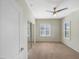 Comfortable bedroom showcasing soft natural light, a ceiling fan, and mirrored closet at 295 N Rural Rd # 128, Chandler, AZ 85226