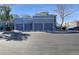 View of the attached garages; each with space for one car, located under the living spaces of the condos at 295 N Rural Rd # 128, Chandler, AZ 85226