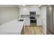 Modern kitchen featuring stainless steel appliances, ample counter space and modern cabinetry at 295 N Rural Rd # 128, Chandler, AZ 85226