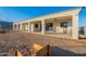 Expansive backyard featuring a covered patio and a vast dirt area ready for customization and landscaping at 4289 W Caribou Ln, Queen Creek, AZ 85142
