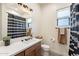 Bright bathroom featuring a single sink vanity, modern fixtures, decorative shower curtain and ample lighting at 4289 W Caribou Ln, Queen Creek, AZ 85142