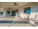Enjoy this spacious patio with a ceiling fan and outdoor seating for relaxation or entertainment at 4289 W Caribou Ln, Queen Creek, AZ 85142