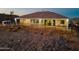 The backyard of this home features a covered patio perfect for relaxing and enjoying the desert setting at 4289 W Caribou Ln, Queen Creek, AZ 85142