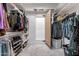 Spacious walk-in closet with shoe racks, shelving, and hanging space for clothes and accessories at 4289 W Caribou Ln, Queen Creek, AZ 85142