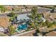 Aerial view of the property, showcasing the pool, patio, and mature landscaping at 4415 W Laurie Ln, Glendale, AZ 85302