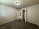 Bedroom featuring carpet flooring, closet, and adjoining rooms at 4621 N 47Th Dr, Phoenix, AZ 85031