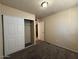 Bedroom featuring carpet floors, closet, and access to adjoining spaces at 4621 N 47Th Dr, Phoenix, AZ 85031