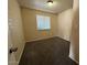 Cozy bedroom with neutral walls, carpet, and a window with blinds at 4621 N 47Th Dr, Phoenix, AZ 85031