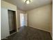 Cozy bedroom featuring neutral walls, carpet flooring, and closet for ample storage at 4621 N 47Th Dr, Phoenix, AZ 85031