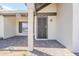 Inviting front porch with brick pavers and decorative security door detail at 4702 N 87Th Ave, Phoenix, AZ 85037