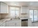 Updated kitchen featuring marble countertops, stainless steel appliances and bright white cabinetry at 4702 N 87Th Ave, Phoenix, AZ 85037