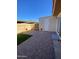 Backyard featuring a brick patio, artificial grass, and a privacy fence at 4845 W Marlette Ave, Glendale, AZ 85301