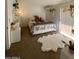 Cozy bedroom with soft carpet, bright decor, and comfortable furnishings create a relaxing atmosphere at 4845 W Marlette Ave, Glendale, AZ 85301