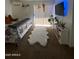 Relaxing bedroom featuring soft carpet, plenty of sunlight, and a modern television at 4845 W Marlette Ave, Glendale, AZ 85301