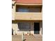 Townhouse exterior with stucco facade, balcony, and tiled roof, creating a warm and inviting curb appeal at 4845 W Marlette Ave, Glendale, AZ 85301