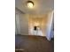 Hallway with carpet, white walls, a light fixture, and a staircase at 4845 W Marlette Ave, Glendale, AZ 85301