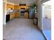 Bright kitchen with wood cabinets, stainless steel appliances, and tile flooring at 4845 W Marlette Ave, Glendale, AZ 85301