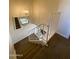 Carpeted staircase leading to the living area with a view reflected in the mirror at 4845 W Marlette Ave, Glendale, AZ 85301