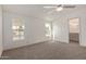 Spacious bedroom with new carpet, a ceiling fan, and bright natural light at 537 S 97Th St, Mesa, AZ 85208