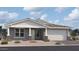 Charming single-story home featuring a two-car garage and low-maintenance desert landscaping at 5521 W Paseo Way, Laveen, AZ 85339