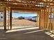 New construction garage with stud framing and a view of the surrounding homes under construction at 5521 W Paseo Way, Laveen, AZ 85339