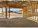 Open-concept living area highlighting the framing, concrete floors, and views of the surrounding landscape at 5521 W Paseo Way, Laveen, AZ 85339