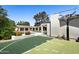 Well-kept basketball court with a hoop and views of the pool and backyard at 6301 E Exeter Blvd, Scottsdale, AZ 85251