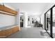 Bright hallway with wood cabinets and a view towards the dining area with lots of light at 6301 E Exeter Blvd, Scottsdale, AZ 85251