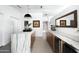 Bright kitchen features marble countertops, wood cabinets, and modern lighting fixtures at 6301 E Exeter Blvd, Scottsdale, AZ 85251